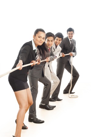 Business executives playing tug-of-warの写真素材