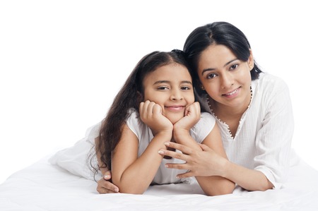 Portrait of a woman smiling with her daughterの写真素材