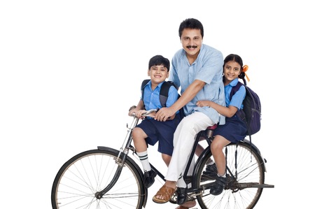 Man with his children on a bicycleの写真素材