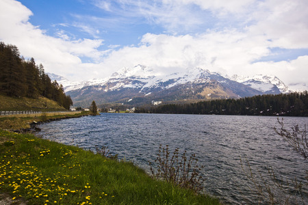 Lake with mountains  in a valley, St. Moritz, Italyの写真素材