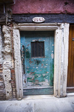 Weathered doorway of a house, Venice, Veneto, Italyの写真素材