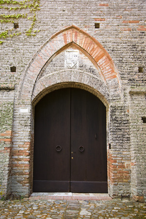 Closed door of a building, Siena, Siena Province, Tuscany, Italyの写真素材