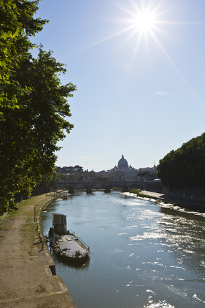 Arch bridge across Tiber River with St. Peter\'s Basilica , Rome, Rome Province, Italyの写真素材