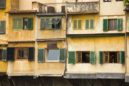 Low angle view of windows of a building, Florence, Tuscany, Italyの写真素材