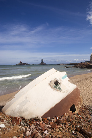Rubbles of a building on the beach with Thiruvalluvar Statue , Kanyakumari, Tamil Nadu, Indiaの写真素材