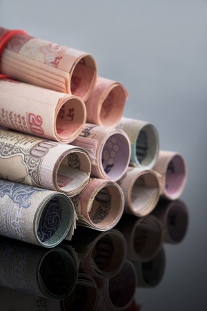 Close-up of rolled-up Indian paper currencyの写真素材