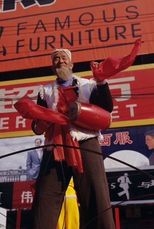 Senior man in traditional costume performingのeditorial素材