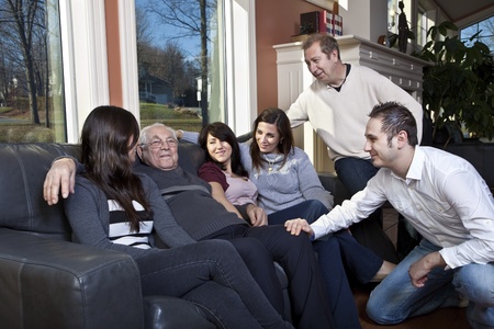 Family visiting elderly relative at a retirement home の写真素材