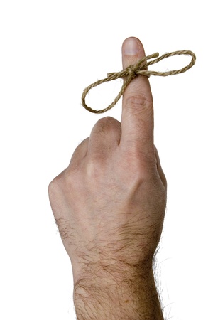 Reminder finger with a tied string maleの写真素材