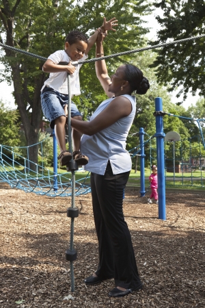 Mother and son playing at a parkの写真素材