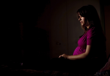Pensive young pregnant womanの写真素材