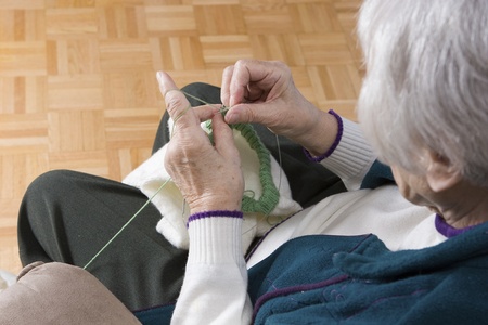 Senior woman knitting horizontal の写真素材