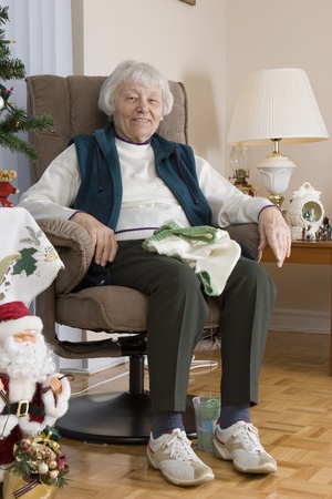 Senior woman knitting vertical の写真素材