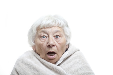 Shocked senior woman with a towel の写真素材