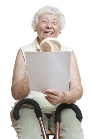 Happy senior reading letter の写真素材