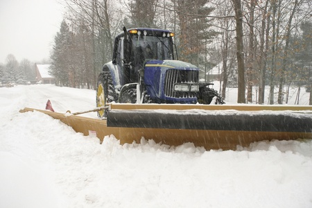 Snow plow cleaning street の写真素材