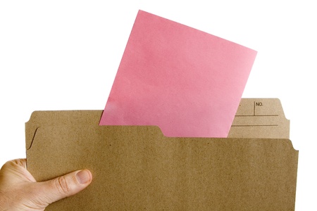 Hand holding file folder with Pink Slip Layoff Notice 