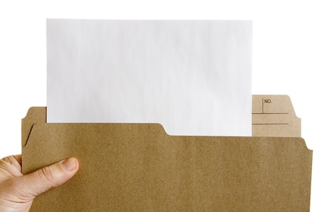 Hand holding file folder with blank sheet of paper 