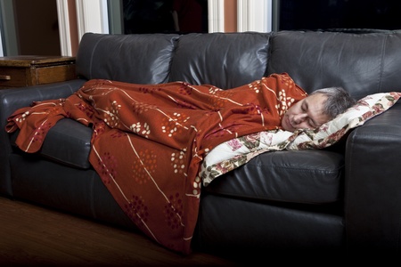 Man sleeping on couch の写真素材