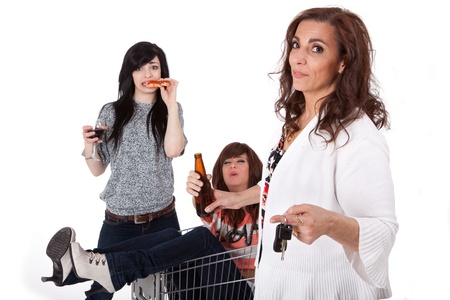 Sober mother taking car keys away from drunk party girls の写真素材