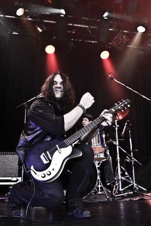 Rock guitarist performing on stage の写真素材
