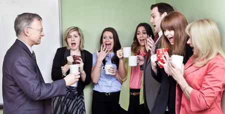 People holding ceramic coffee cups looking in horror at mans eco unfriendly cup の写真素材