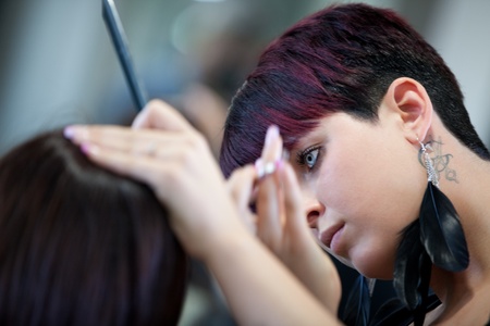 Hairdresser cutting hairの写真素材