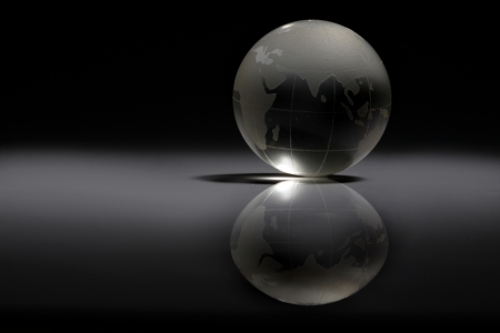 Close-up of a crystal globe on black background