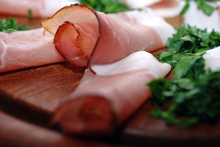 raw ham on wooden boardの写真素材