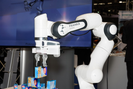 Hannover, Germany - March 22, 2017: The sensitive robot Franka from the company Franka Emika demonstrates its ability on the booth of the company at CeBIT 2017. CeBIT is the world's largest trade fair for information technology.のeditorial素材
