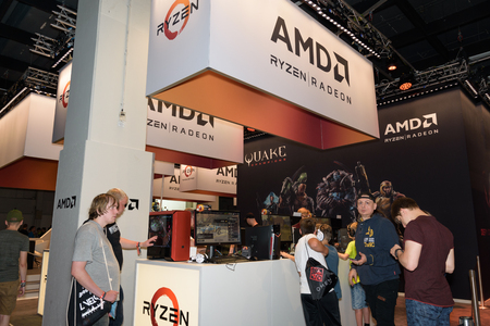 Cologne, Germany - August 24, 2017: Visitors at the booth of the processor and graphics card...
