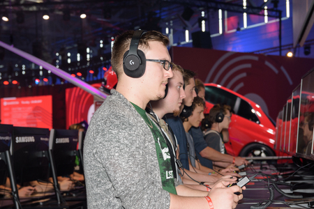 Cologne, Germany - August 24, 2017: Trade fair visitors playing the project cars 2 game at Gamescom...