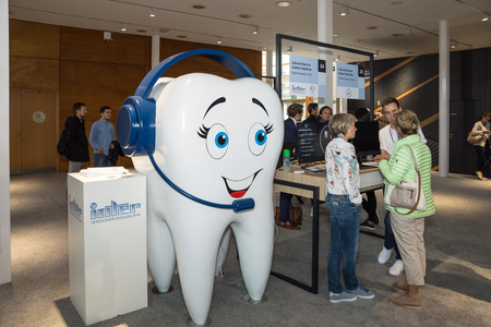Hannover, Germany - June 13, 2018: Huge dental model on the booth of the insurance Inter at CeBIT 2018. CeBIT is the world's largest trade fair for information technology.のeditorial素材