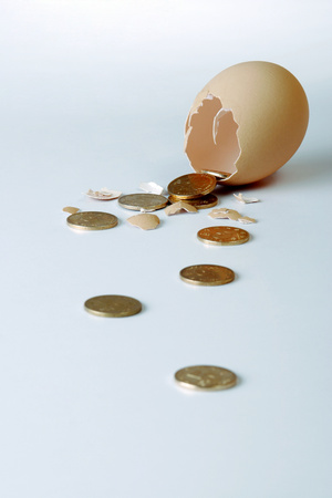 Coins coming out from a broken egg