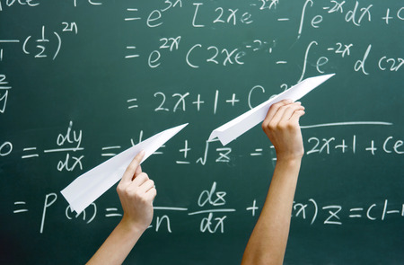 Hands holding paper planes