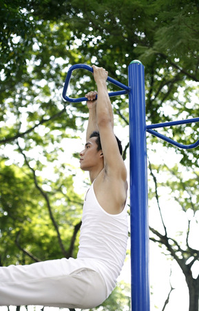 Man lifting himself off the ground