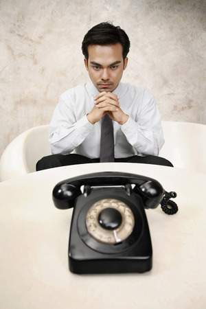 Businessman waiting for a phone callの写真素材