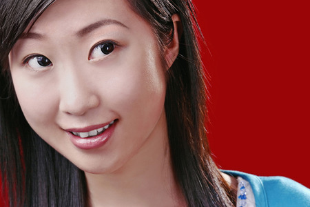 Woman smiling while looking awayの写真素材