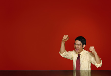 Businessman clenching fist and cheeringの写真素材