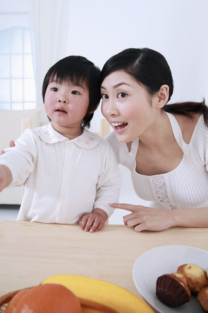 Woman and girl looking awayの写真素材