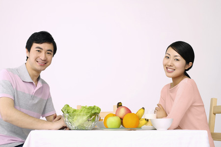 Man and woman having breakfastの写真素材