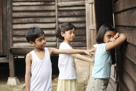 Children playing traditional game in the house compoundの写真素材