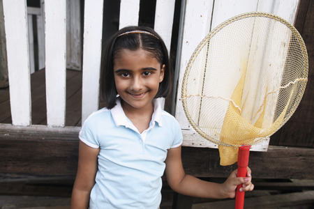 Girl holding a fishing netの写真素材
