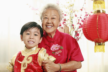 Senior woman and boy posing for the cameraの写真素材