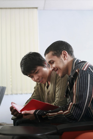 Men having discussion in the lecture hallの写真素材