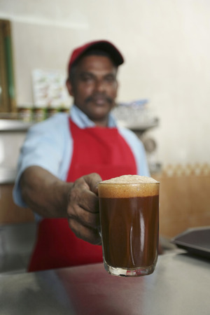 Man serving coffeeの写真素材
