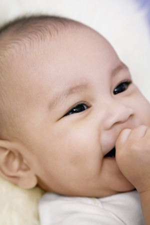 Baby sucking her fingerの写真素材