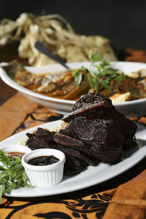 Slices of char-grilled marinated sirloin, served with a spicy tamarind dip and sambal belacanの写真素材