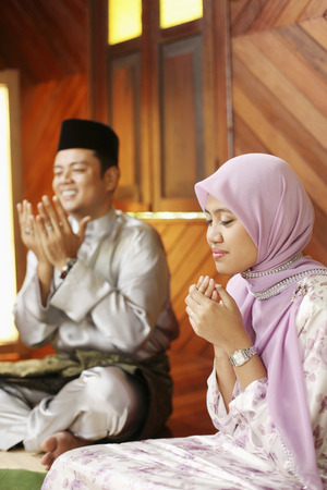 Man and woman saying graceの写真素材