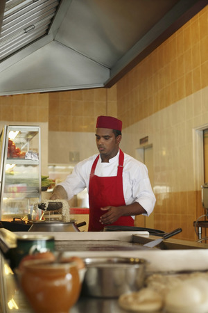 Man preparing noodlesの写真素材